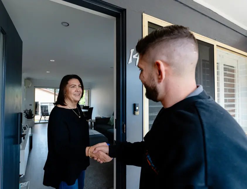 Greeting a customer at the door